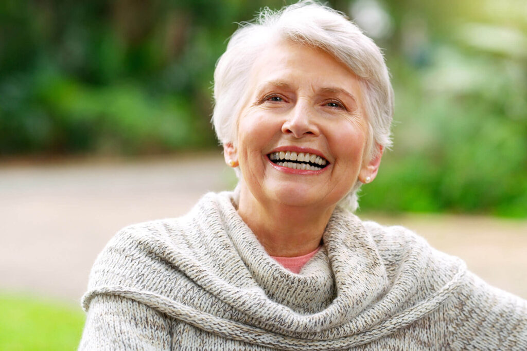 smiling elderly woman in nature