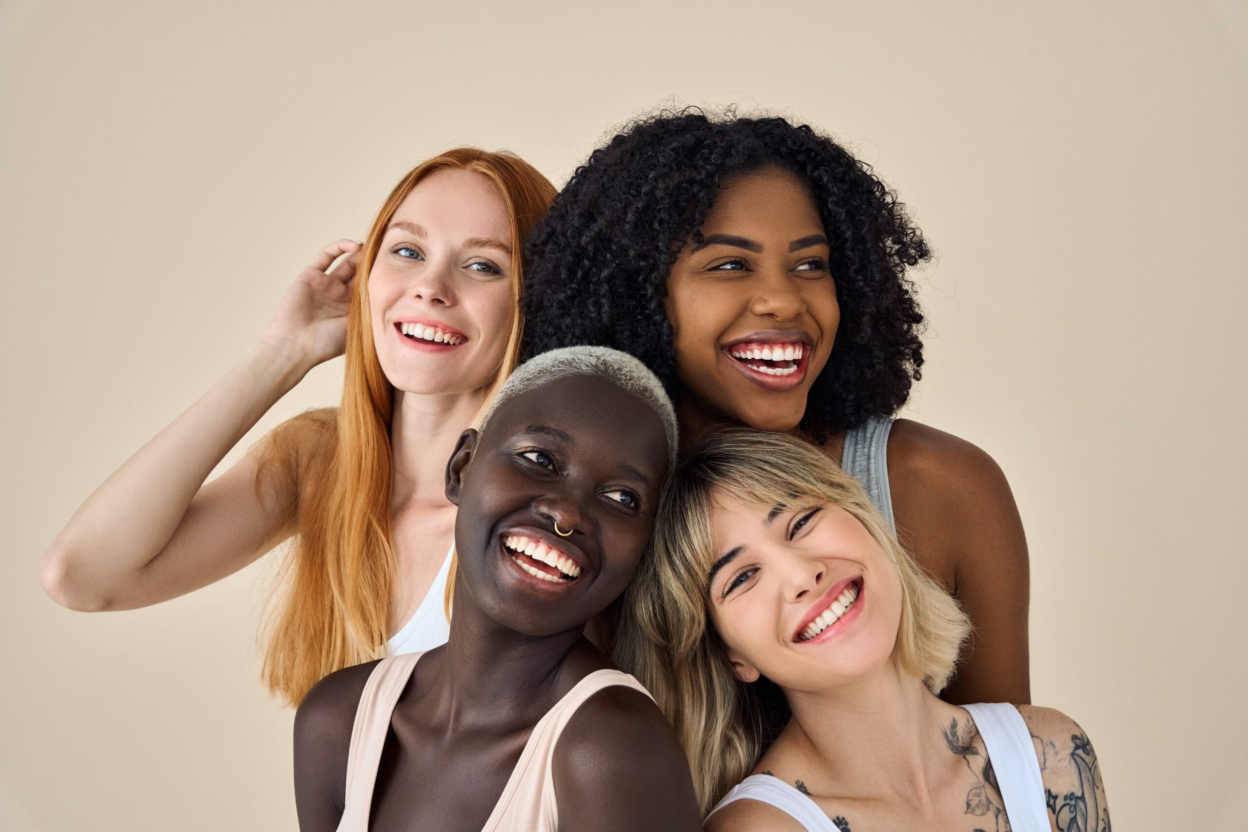 Happy positive cool diverse young women, four smiling multiethnic beauty faces models gen z