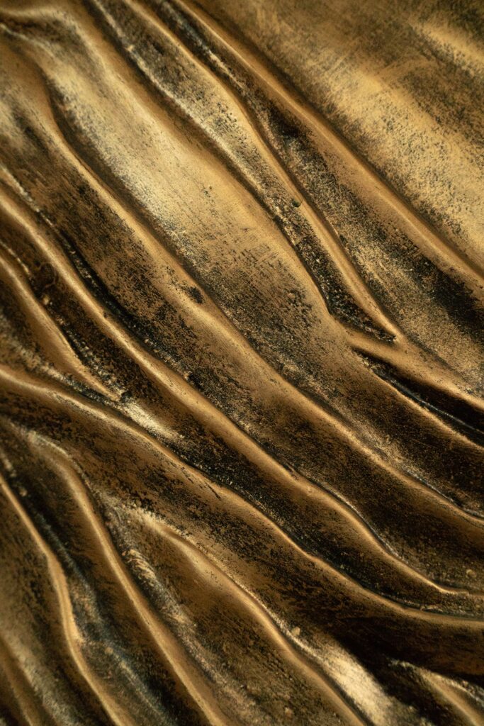 Classic sculpted statue of Buddha with wet curtain technique