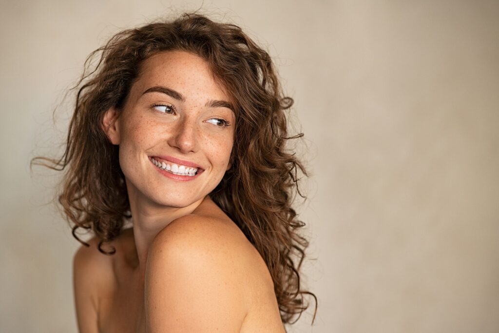 Portrait of smiling girl enjoying beauty treatment