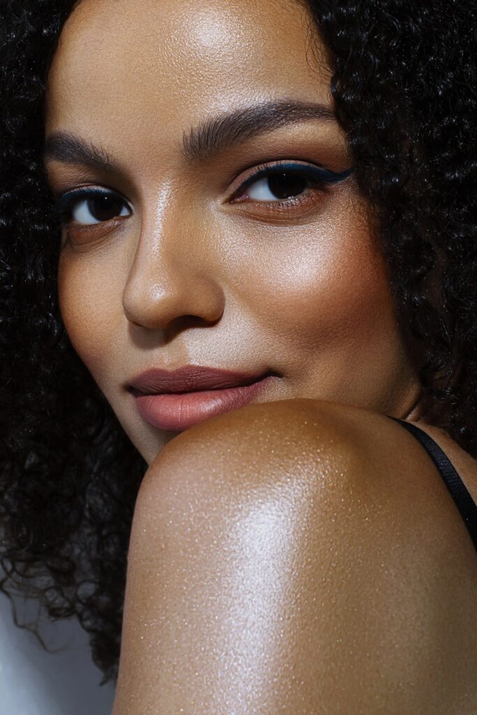 Close-up portrait of beautiful young woman. glowing dark skin