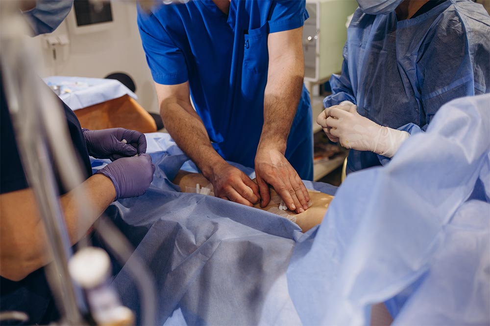 the doctor glues a plaster after the operation
