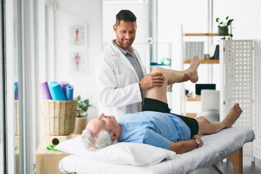 Physiotherapy, leg pain and mature patient stretching for orthopedic care, consulting and wellness
