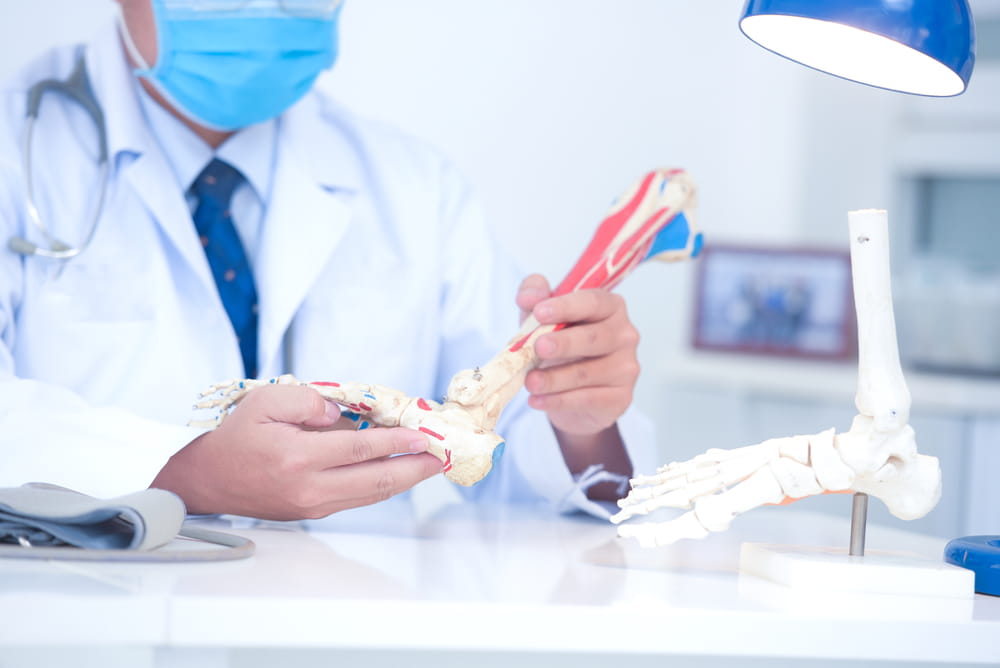 orthopedic doctor with foot diagram