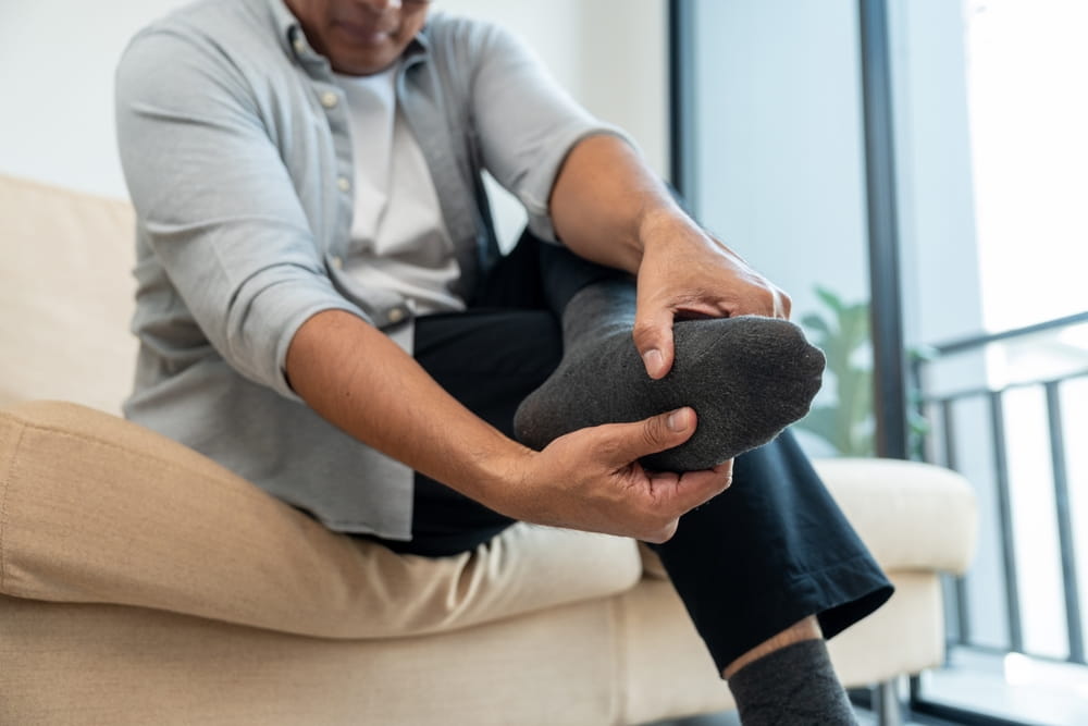 Close up old man leg knee pain feet. Mature senior man pain with ankle because walk too much
