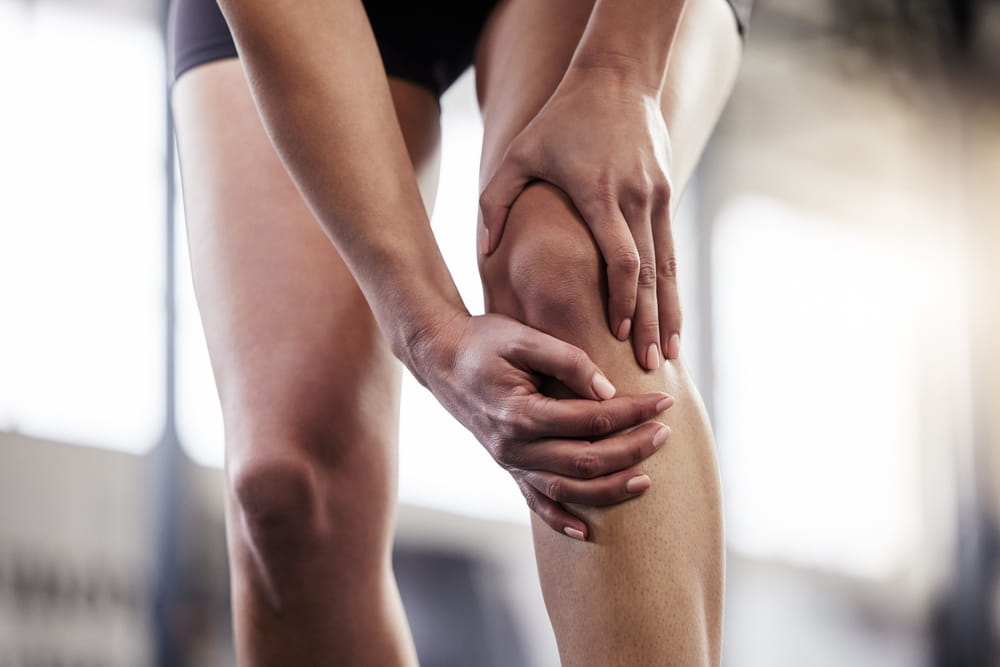 Person, hand and knee pain for workout exercise or joint inflammation for running, training or fitness