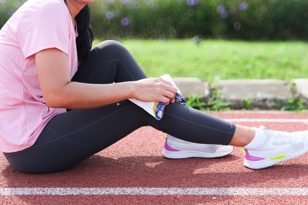 Leg Injury. Icing Ankle With Cold Pack And Ice, health and sports concept, sstkhealth