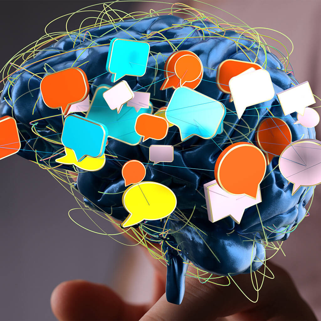 Human Brain with Colorful Speech Bubbles: Communication and Ideas