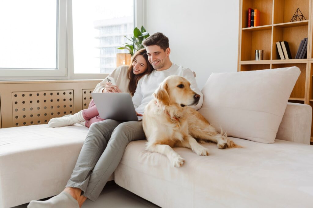 happy young couple using laptop