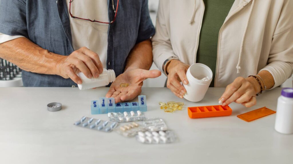 Unrecognizable couple diligently managing their medications together in pursuit of achieving better overall health outcomes