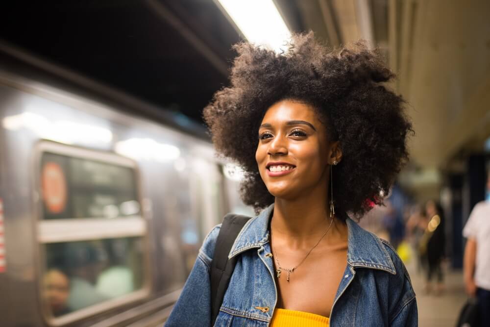 Happy and beautiful african american woman smiling. Pretty young female walking and having fun in New York city