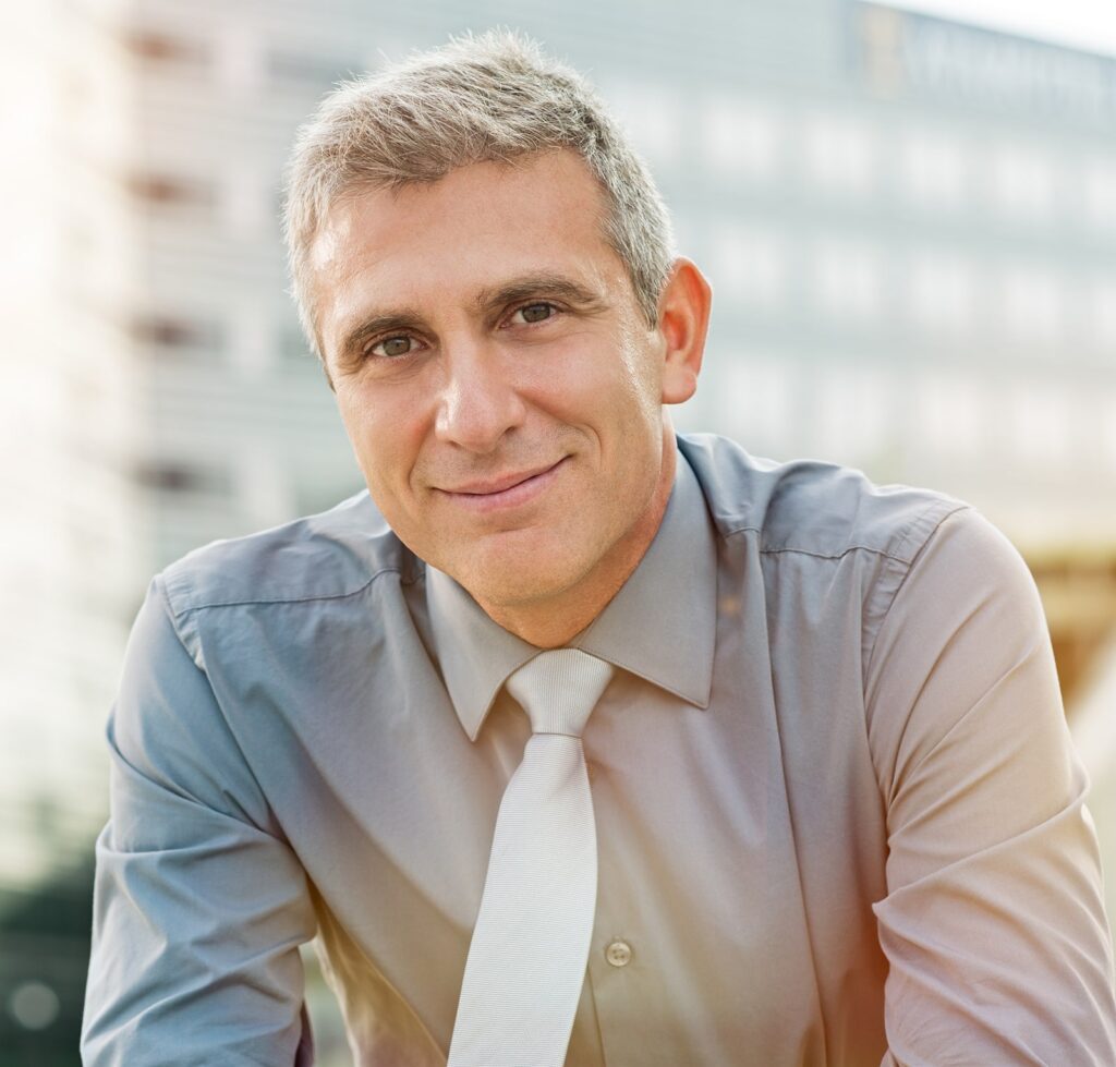 Closeup Of Happy Mature Businessman Smiling Outdoor