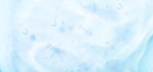 Cosmetic gel, serum transparent sample. Liquid cream with bubble texture. Gel texture of a cosmetic product