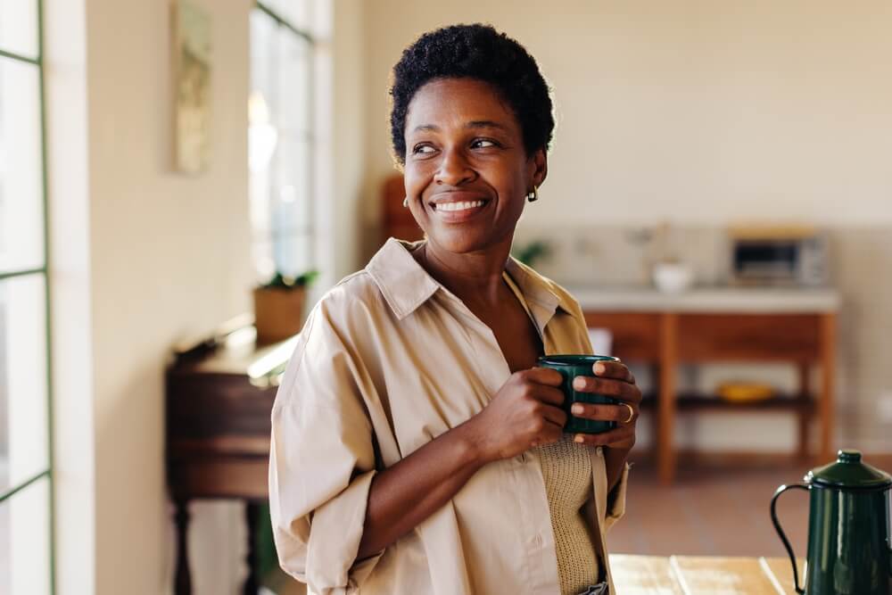 Happy woman looking outside