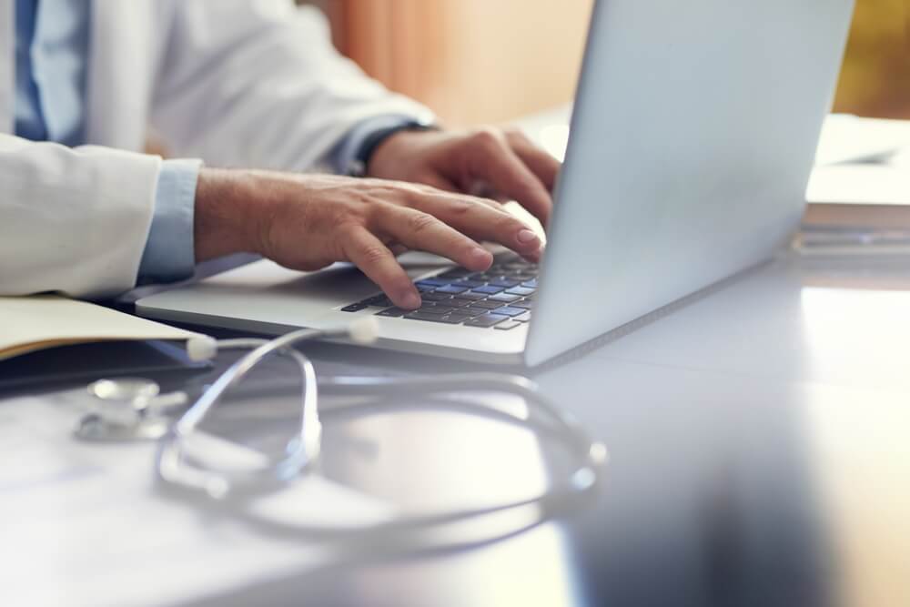 Medical, doctor and hands on computer in hospital for research,