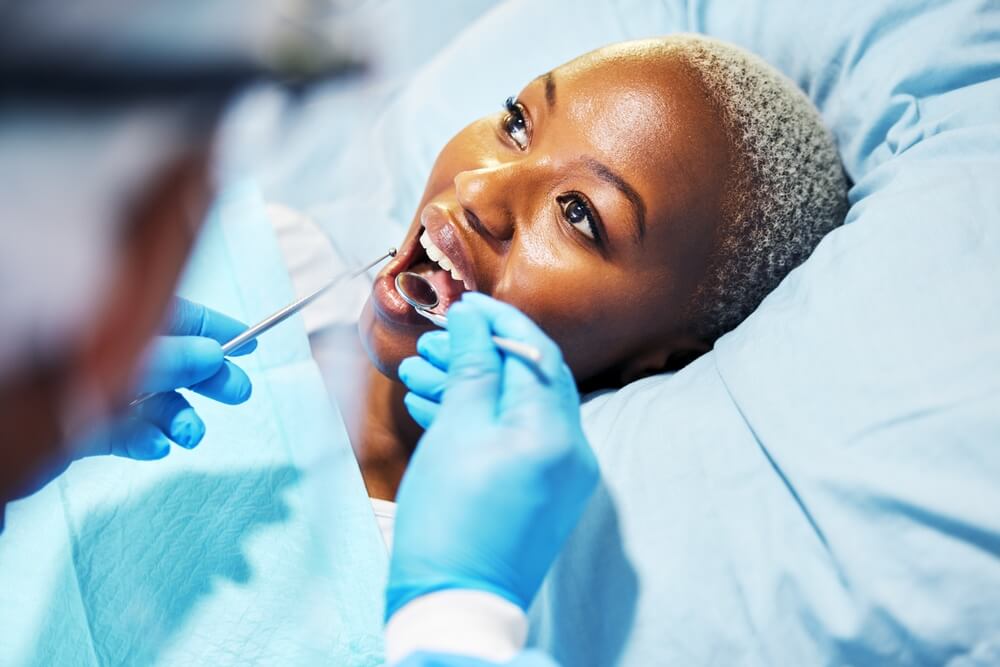 Dentist, inspection and woman with tools in mouth