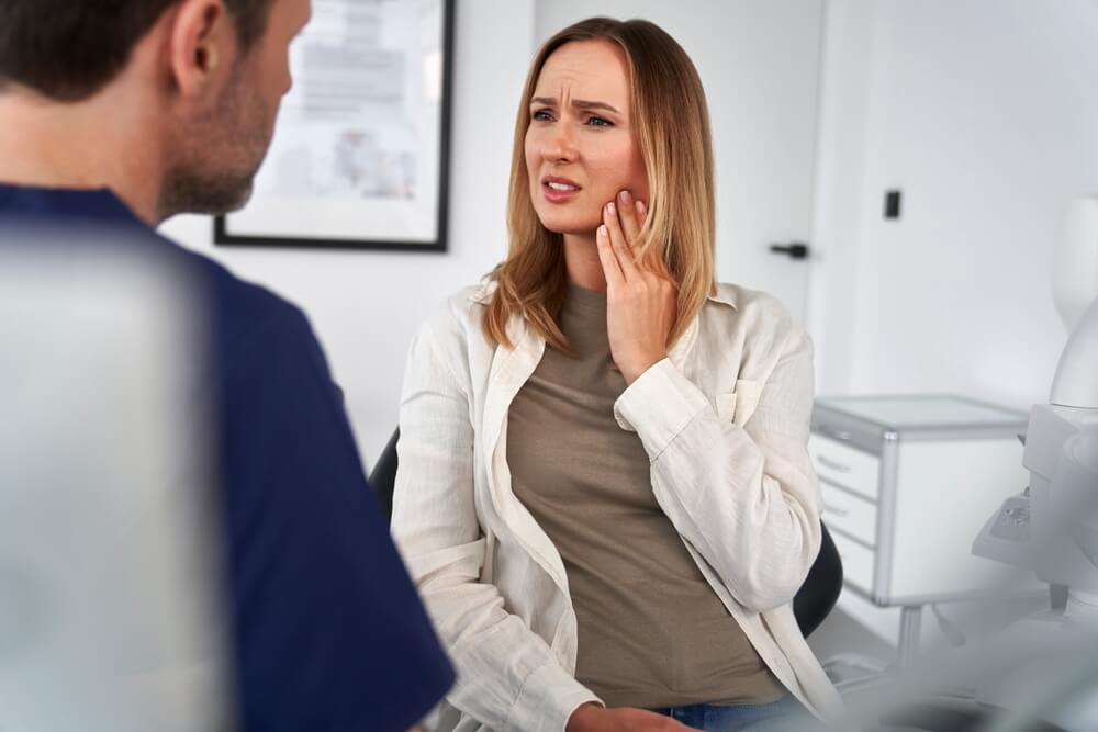 Female patient talking about the toothache