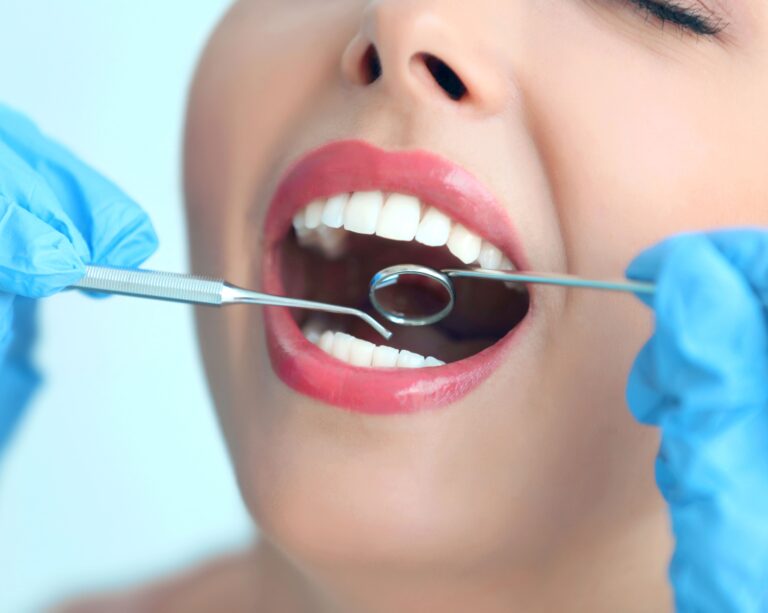 Woman with perfect smile getting dental exam