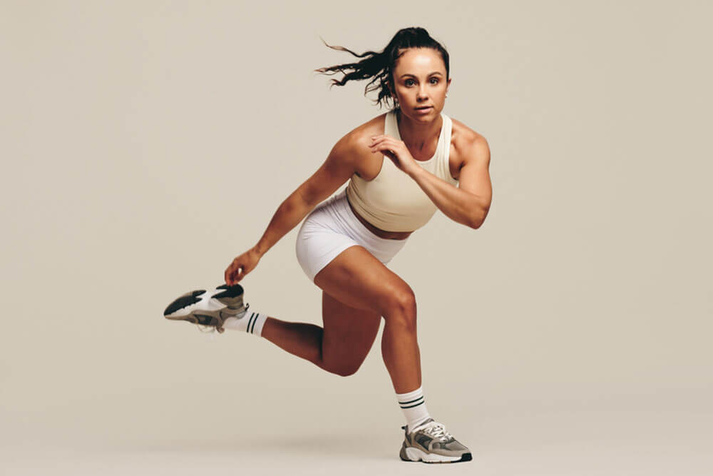 Young female athlete performing strength training
