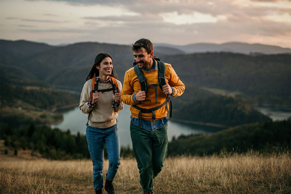 couple going for a hike up the mountain