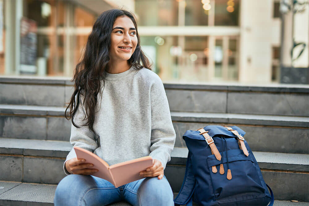 Young student girl smiling happy