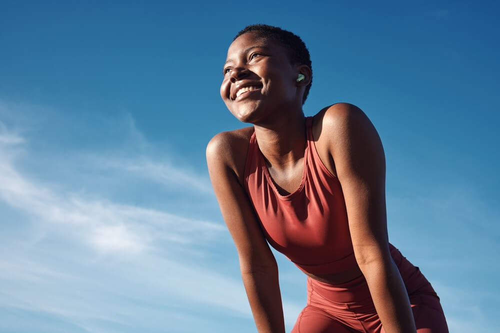 woman and happy athlete smile after running