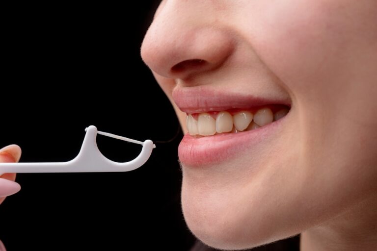 Dental tools and white tooth. Close up teeth with dental mirror. Dental treatment