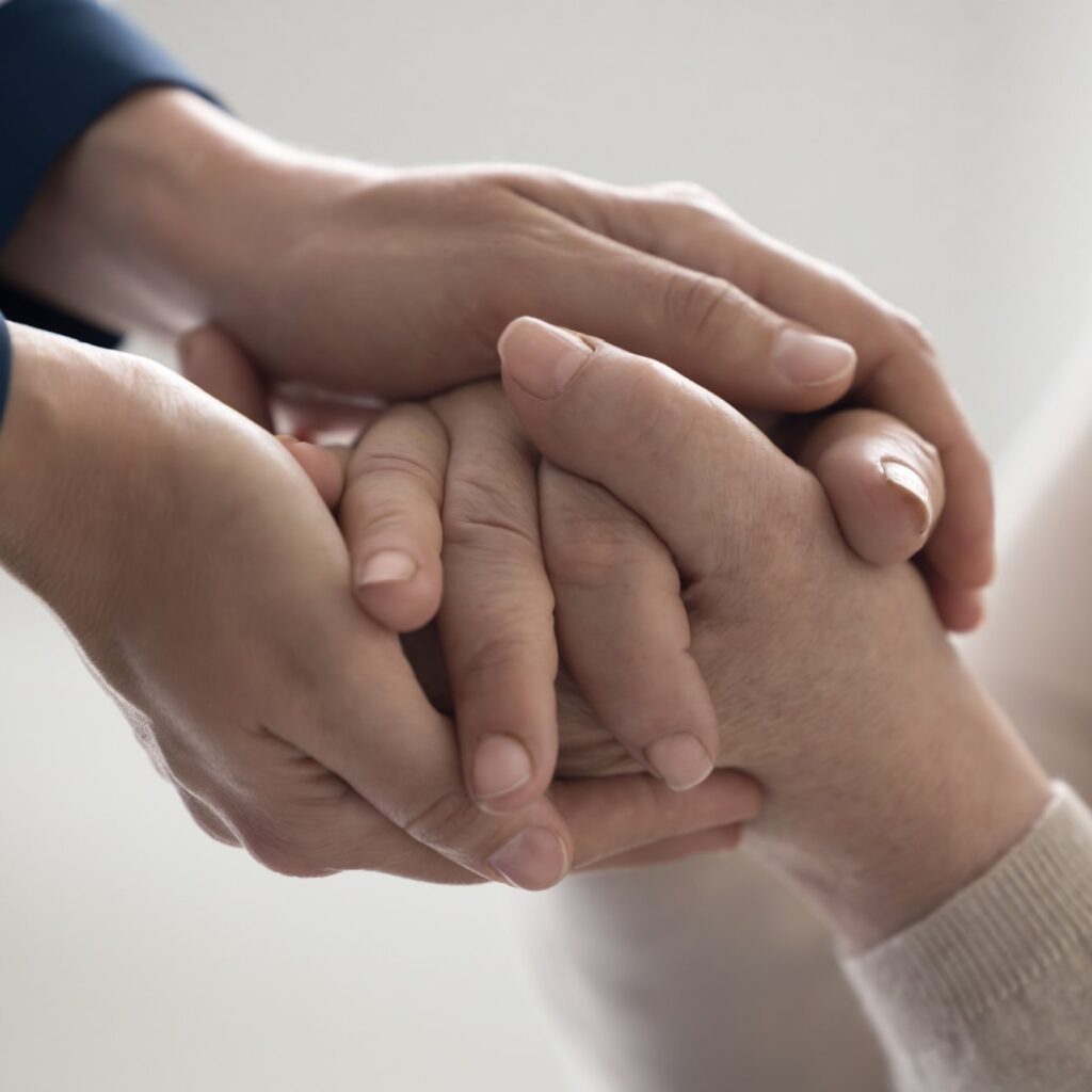 Doctor woman holding hands of senior female patient