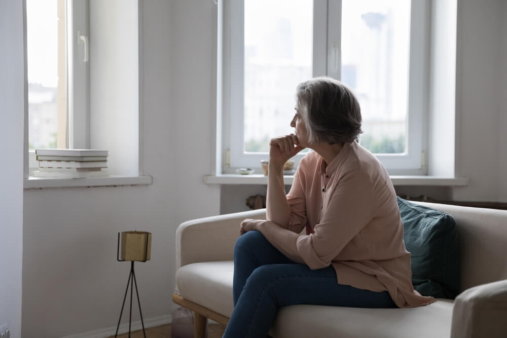 Sad lonely mature grey haired lady