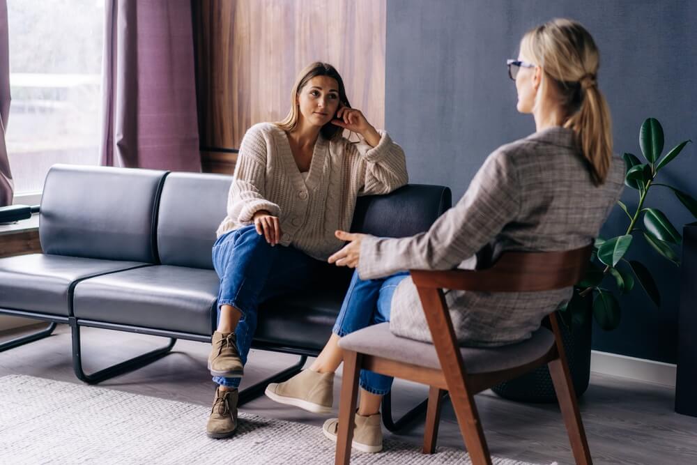 A young woman in a consultation with a professional psychologist