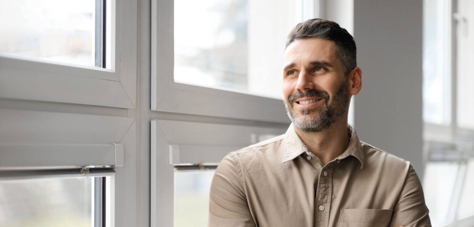 Man standing near window