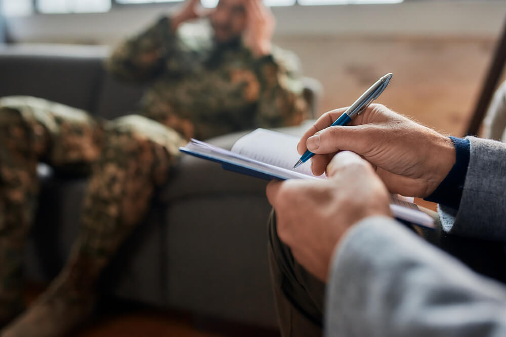 hands of psychologist making notes