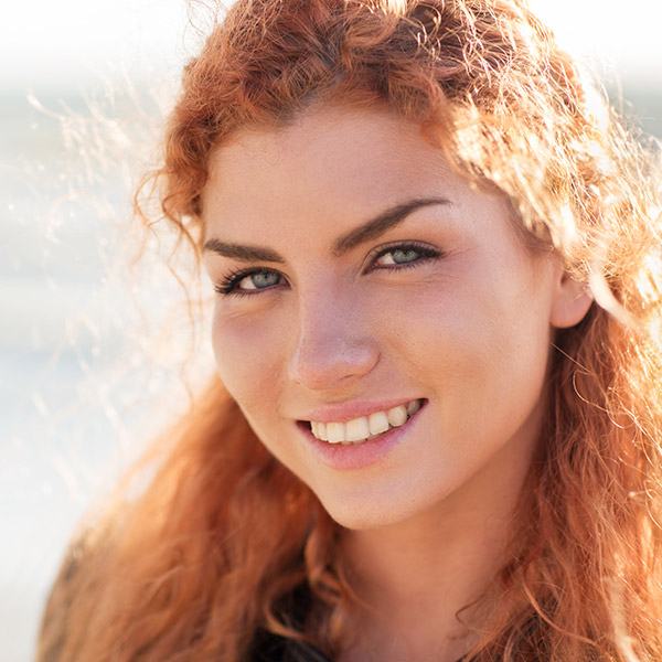 happy young redhead woman face