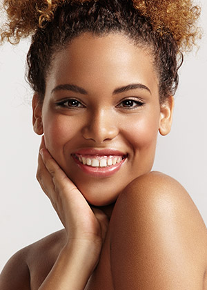 happy woman with round hair and ideal skin