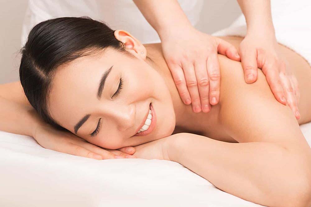 Woman getting Full Body Therapy Massage