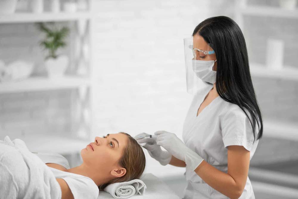 Woman getting PRP hair treatment