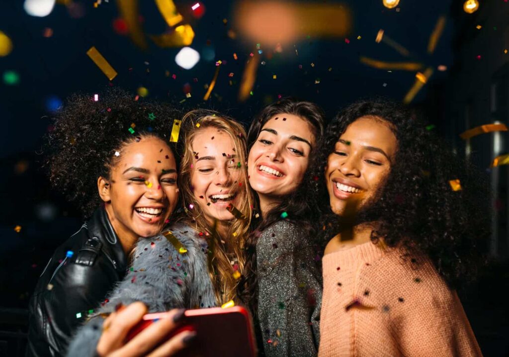 Women partying taking selfie