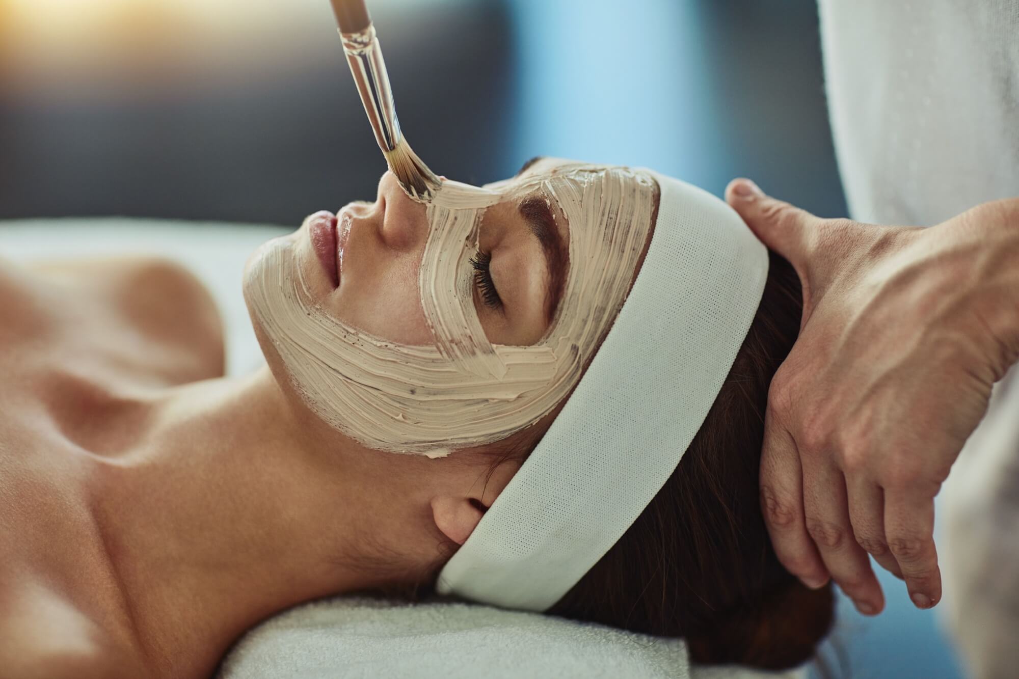 Woman, spa and face mask with brush